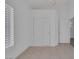 Bedroom featuring a window with shutters, closet, and tile flooring at 5808 Spinnaker Reach Ave, Las Vegas, NV 89130