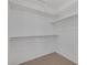 Spacious walk-in closet featuring built-in shelving and ample storage space at 5808 Spinnaker Reach Ave, Las Vegas, NV 89130