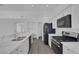 Close up of updated kitchen with stainless appliances and elegant marble countertops at 5808 Spinnaker Reach Ave, Las Vegas, NV 89130