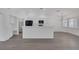 Bright kitchen featuring white cabinetry, modern appliances, and a breakfast bar at 5808 Spinnaker Reach Ave, Las Vegas, NV 89130