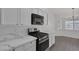 Updated kitchen featuring stainless steel gas range and black microwave at 5808 Spinnaker Reach Ave, Las Vegas, NV 89130