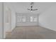 Spacious main bedroom featuring large windows with plantation shutters at 5808 Spinnaker Reach Ave, Las Vegas, NV 89130