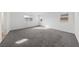 Spacious bedroom with plush gray carpet, recessed lighting, and natural light from the windows at 595 Beverly Pine Pl, Henderson, NV 89011