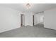 Upstairs bedroom with plush gray carpet, neutral walls, and a modern light fixture at 595 Beverly Pine Pl, Henderson, NV 89011