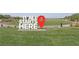 A view of Central Park with a sign that reads, 'It All Starts Here.' at 595 Beverly Pine Pl, Henderson, NV 89011
