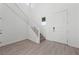 Bright and airy foyer with staircase, durable flooring, and a large entry door at 595 Beverly Pine Pl, Henderson, NV 89011