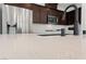 Close up on the kitchen featuring a quartz countertop, a stainless steel sink, and a modern faucet at 595 Beverly Pine Pl, Henderson, NV 89011