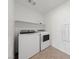 Functional laundry room with modern washer and dryer at 595 Beverly Pine Pl, Henderson, NV 89011