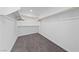 Walk-in closet features gray carpet and custom shelving and clothing rods for optimal organization at 595 Beverly Pine Pl, Henderson, NV 89011