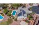 Overhead shot of a home showcasing a pool, solar panels, a basketball court, and low-maintenance landscaping at 7141 Groveton Ct, Las Vegas, NV 89131