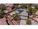 Aerial shot showcasing the property with a basketball court, a covered car, and a solar-paneled roof at 7141 Groveton Ct, Las Vegas, NV 89131