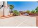 Outdoor basketball court area featuring a basketball hoop, trees, and a covered car on a sunny day at 7141 Groveton Ct, Las Vegas, NV 89131