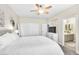 Bright bedroom with ceiling fan and ensuite bathroom at 7141 Groveton Ct, Las Vegas, NV 89131