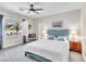 Bright bedroom with natural light, ceiling fan, and comfortable furnishings at 7141 Groveton Ct, Las Vegas, NV 89131