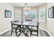 Cozy dining area with shuttered windows and a modern chandelier creates a comfortable meal space at 7141 Groveton Ct, Las Vegas, NV 89131
