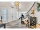 Welcoming foyer featuring the staircase, high ceilings, elegant chandelier and double-door entryway at 7141 Groveton Ct, Las Vegas, NV 89131