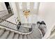 Expansive foyer showcasing the staircase, high ceilings, elegant chandelier and double-door entryway at 7141 Groveton Ct, Las Vegas, NV 89131