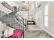 Stunning foyer showcasing the staircase, high ceilings, elegant chandelier and double-door entryway at 7141 Groveton Ct, Las Vegas, NV 89131