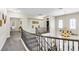 Upstairs hallway with decorative railings and views of the foyer, showcasing the home's open layout at 7141 Groveton Ct, Las Vegas, NV 89131