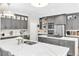 Beautiful kitchen with a large center island, gray cabinets, and stainless steel appliances at 7141 Groveton Ct, Las Vegas, NV 89131