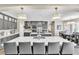 Bright, open kitchen with a large island, pendant lighting, and an adjacent dining area at 7141 Groveton Ct, Las Vegas, NV 89131