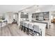 Spacious kitchen features a large island with seating and stylish gray cabinets at 7141 Groveton Ct, Las Vegas, NV 89131