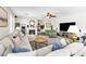 Spacious living room featuring cozy furniture, a fireplace, and bright natural light at 7141 Groveton Ct, Las Vegas, NV 89131