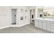 Bright primary bathroom featuring a separate shower and vanity area with storage and elegant finishes at 7141 Groveton Ct, Las Vegas, NV 89131