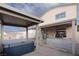 Backyard featuring a covered patio, outdoor kitchen, hot tub and brick patio area at 760 Camino La Paz, Henderson, NV 89012