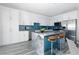 Modern kitchen featuring sleek cabinetry, stainless steel appliances, and a stylish island at 760 Camino La Paz, Henderson, NV 89012