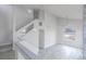 Bright living room features a staircase and modern fixtures and finishes at 760 Camino La Paz, Henderson, NV 89012