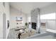 Bright living room features a stone fireplace, modern fixtures and finishes at 760 Camino La Paz, Henderson, NV 89012