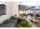 Cozy covered patio with outdoor seating, BBQ area, and lush landscaping at 760 Camino La Paz, Henderson, NV 89012