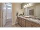 Bright bathroom featuring a double sink vanity with granite countertop and a separate tub/shower at 7665 Serenity Bay Ln # Lot 58, North Las Vegas, NV 89084