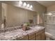 Bathroom featuring double vanity with granite counters, large mirror and separate shower at 7665 Serenity Bay Ln # Lot 58, North Las Vegas, NV 89084
