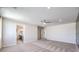 View of carpeted bedroom featuring natural light and an ensuite bathroom at 7665 Serenity Bay Ln # Lot 58, North Las Vegas, NV 89084