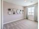 Bright bedroom with a large window and stylish wall decor at 7665 Serenity Bay Ln # Lot 58, North Las Vegas, NV 89084