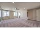 Large carpeted bedroom with bright natural light, recessed lighting, and a ceiling fan at 7665 Serenity Bay Ln # Lot 58, North Las Vegas, NV 89084