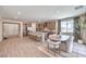 Open floor plan featuring a kitchen island and dining area perfect for entertaining and gatherings at 7665 Serenity Bay Ln # Lot 58, North Las Vegas, NV 89084