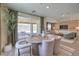 Bright dining room features a modern table, chairs, and sliding door to the outdoor patio at 7665 Serenity Bay Ln # Lot 58, North Las Vegas, NV 89084