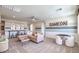 Spacious game room featuring a cozy sectional sofa, game table, and stylish decor at 7665 Serenity Bay Ln # Lot 58, North Las Vegas, NV 89084