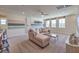Stylish game room with a sectional sofa, game table, bar seating, and modern decor at 7665 Serenity Bay Ln # Lot 58, North Las Vegas, NV 89084