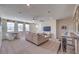 Bright and airy game room with comfortable seating, game table, and bar seating at 7665 Serenity Bay Ln # Lot 58, North Las Vegas, NV 89084