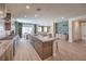 Open-concept kitchen featuring granite counters, stainless appliances, and seamless flow to the living spaces at 7665 Serenity Bay Ln # Lot 58, North Las Vegas, NV 89084