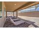 Spacious covered patio complete with pavers and modern patio furniture at 7665 Serenity Bay Ln # Lot 58, North Las Vegas, NV 89084