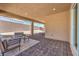 The covered patio with brick flooring is the perfect spot for outdoor relaxation at 7665 Serenity Bay Ln # Lot 58, North Las Vegas, NV 89084