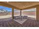 An elegant covered patio with pavers offers a serene outdoor living space at 7665 Serenity Bay Ln # Lot 58, North Las Vegas, NV 89084