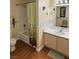 Bathroom with tub/shower, vanity, and floral accents at 8101 W Flamingo Rd # 2078, Las Vegas, NV 89147