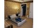 Bedroom with minimalist platform bed, walk-in closet, and floral wallpaper at 8101 W Flamingo Rd # 2078, Las Vegas, NV 89147