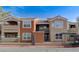 Multi-level apartment building with a combination of beige and brown exterior paint and wrought iron gated fence at 8101 W Flamingo Rd # 2078, Las Vegas, NV 89147